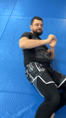 Wrestling training session between adult and child in Krasnoyarsk