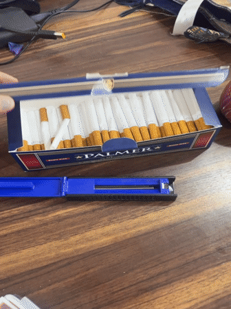 Man handles cigarettes, takes selfie in decorated room in Syria