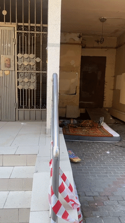 Man found lying motionless near vegetated building in Sochi
