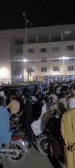 Large motorcycle crowd gathers at night in Quetta streets