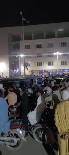 Large motorcycle crowd gathers at night in Quetta streets