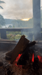 Fire pit burns on porch in Baturiti, Indonesia