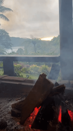 Fire pit burns on porch in Baturiti, Indonesia