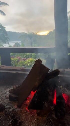 Fire pit burns on porch in Baturiti, Indonesia