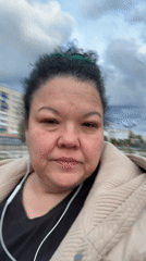 Woman walks through residential park area early morning