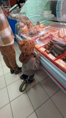 Morning café scene captures child and adult customer in Rusanovo