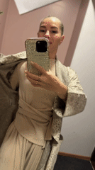 Woman records selfie video in Abakan home stairway