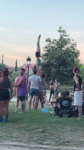 Acro-yoga session in Barcelona park flows into evening drinks