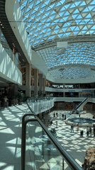 Shopping mall exploration in Sochi with fountains and city views