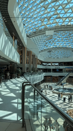Shopping mall exploration in Sochi with fountains and city views