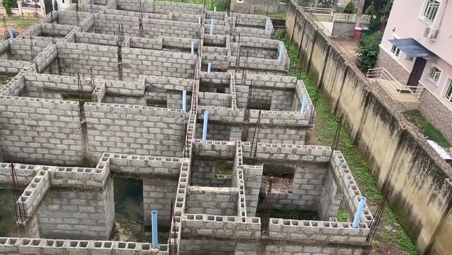 Abuja neighborhood scenes mix construction aerials with personal moments