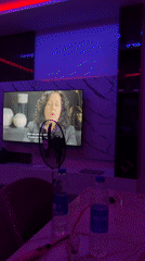 Neon-lit room with television captured in Rubuchi, Nigeria