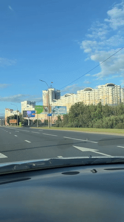 Highway drive through Minsk with buildings lining the route