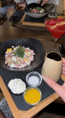 Pouring salad dressing at lunch in Madrid