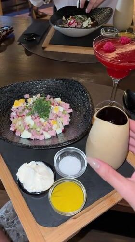 Pouring salad dressing at lunch in Madrid