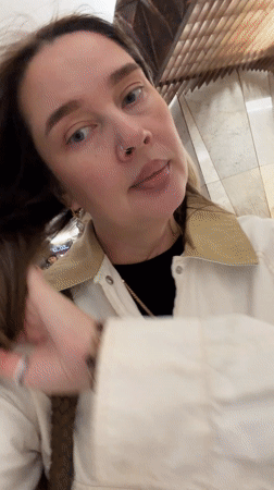 Woman films herself on Moscow subway platform