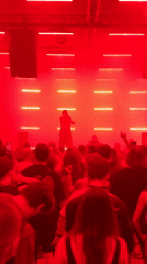 Underground concert venue fills with performers and dancing crowds