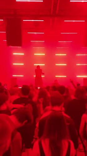 Underground concert venue fills with performers and dancing crowds