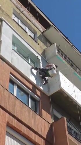 Construction workers renovate building exterior in Blagoevgrad, Bulgaria