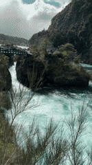 Turquoise river through forested gorge documented near Puerto Varas