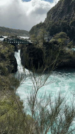 Turquoise river through forested gorge documented near Puerto Varas