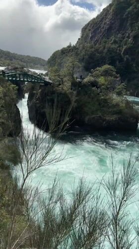 Turquoise river through forested gorge documented near Puerto Varas