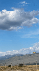 Yellow crop duster and helicopter activity over Podgorica Airport area