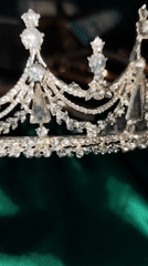 Woman conducts beauty product demonstration with crown in Istanbul