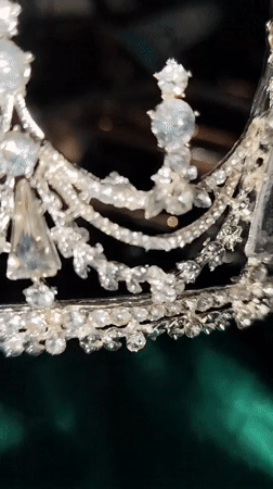Woman conducts beauty product demonstration with crown in Istanbul