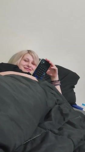 Person with blonde hair resting in bed in Bangkok