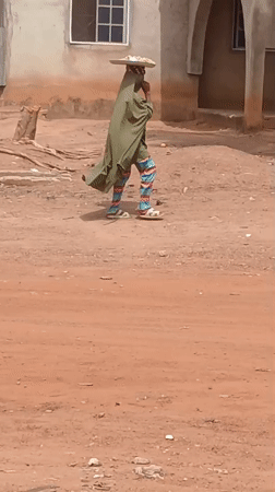 Daily life documented in Nigerian neighborhoods during midday hours