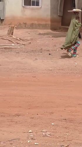 Daily life documented in Nigerian neighborhoods during midday hours