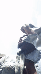 Man in denim jacket performs outdoors in multiple video segments