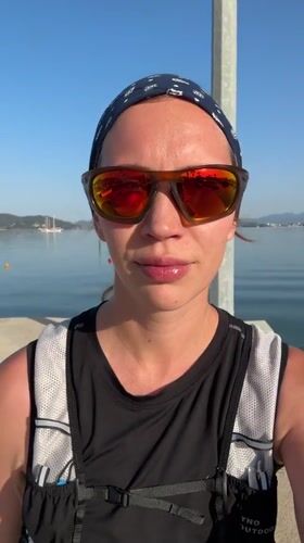 Woman in sportswear photographed at Fethiye harbor early morning