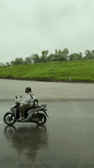 Rainy night traffic scene captured in Hanoi