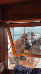 Man in floral shirt spotted aboard wooden boat in Labuan Bajo