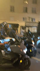 Motorcyclists gather on Paris street Saturday evening