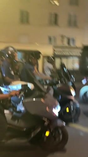 Motorcyclists gather on Paris street Saturday evening