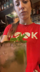 Bartender serves cocktails at Barcelona cafe as pigeon visits