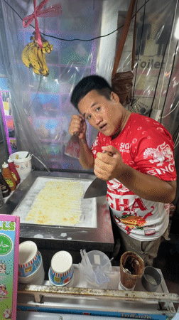 Street vendor prepares rolled ice cream in Patong