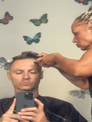 Man documents haircut with mirror selfies at Kuta salon