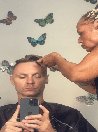 Man documents haircut with mirror selfies at Kuta salon