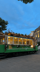 Christmas-decorated tourist tram spotted near domed building in Sofia
