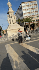 Violinist performs street music in Catania plaza