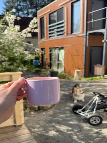 Morning coffee moment captured on sunny patio in Gangloff