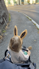 Bunny ears and a stroller in Erba, Italy