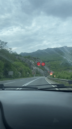 Driver approaches tunnel on Montenegro highway under overcast skies