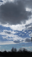 Helicopter spotted flying through cloudy skies over Yurgamysh, Russia