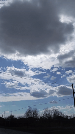 Helicopter spotted flying through cloudy skies over Yurgamysh, Russia