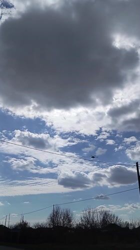 Helicopter spotted flying through cloudy skies over Yurgamysh, Russia